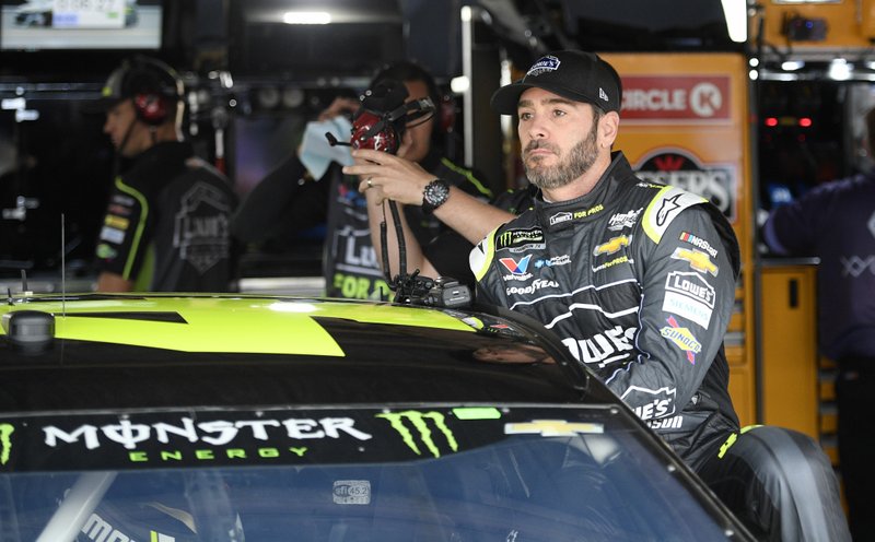 Jimmie Johnson climbs into his car before practice for the NASCAR Cup series auto race, Saturday, May 5, 2018, at Dover International Speedway in Dover, Del. (AP Photo/Nick Wass)