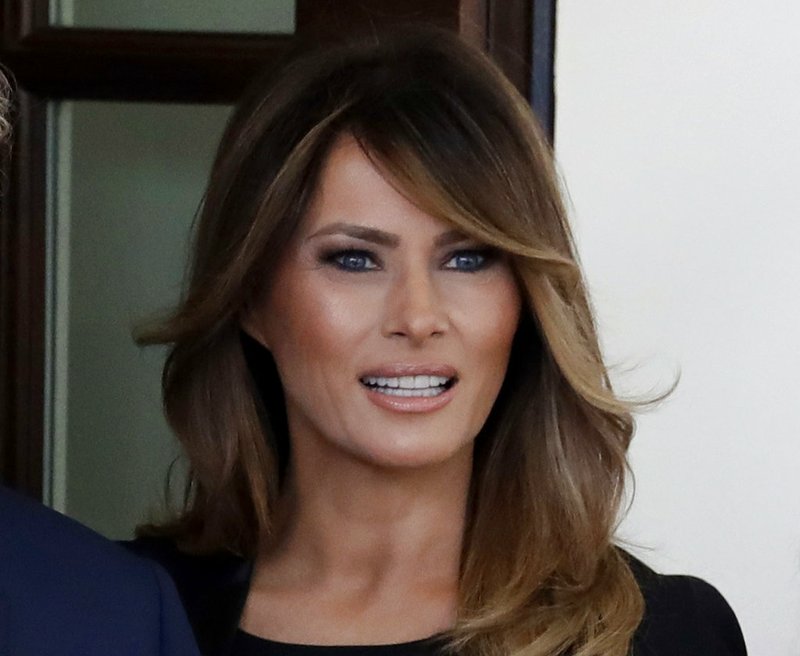 FILE - In a Monday, April 23, 2018 file photo,  first lady Melania Trump greet French President Emmanuel Macron and his wife Brigitte Macron at the White House, in Washington. he White House says Melania Trump will announce her initiatives as first lady on Monday, May 7, 2018.  The first lady's spokeswoman, Stephanie Grisham, says the focus will be on the overall well-being of children, which Mrs. Trump has spoken about since becoming first lady.  (AP Photo/Evan Vucci, File)