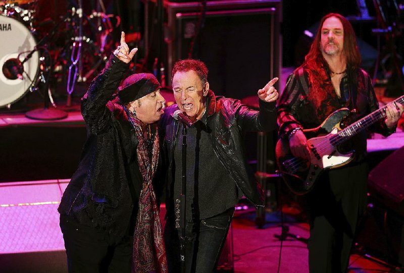 Musician and actor Steven Van Zandt and Bruce Springsteen sing after Van Zandt received his Performing Arts award during the 10th Anniversary Induction Ceremony of the New Jersey Hall of Fame at the Paramount Theater in Convention Hall in Asbury Park, N.J., Sunday, May 6, 2018. (Bob Karp/The Daily Record via AP)