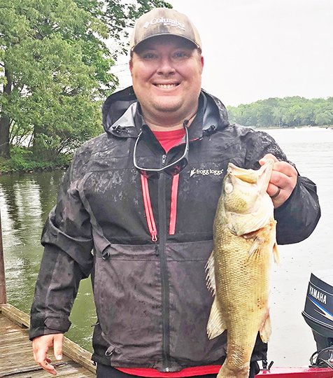 Submitted photo PRIZE FISH: Michael Long, an angler from Hot Springs, holds the first prize fish caught in the 2018 Hot Springs Fishing Challenge. The 4.5-pound largemouth bass is worth $1,000, and was boated on Lake Hamilton near Hill Wheatley Park.