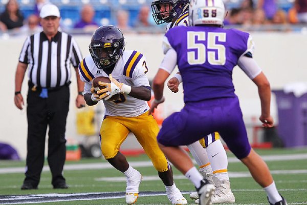 Mayflower running back Deon Simmons carries the ball during a game against Central Arkansas Christian on Tuesday, Aug. 29, 2017, at War Memorial Stadium in Little Rock.