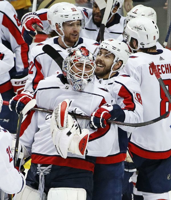 Caps finally top Penguins