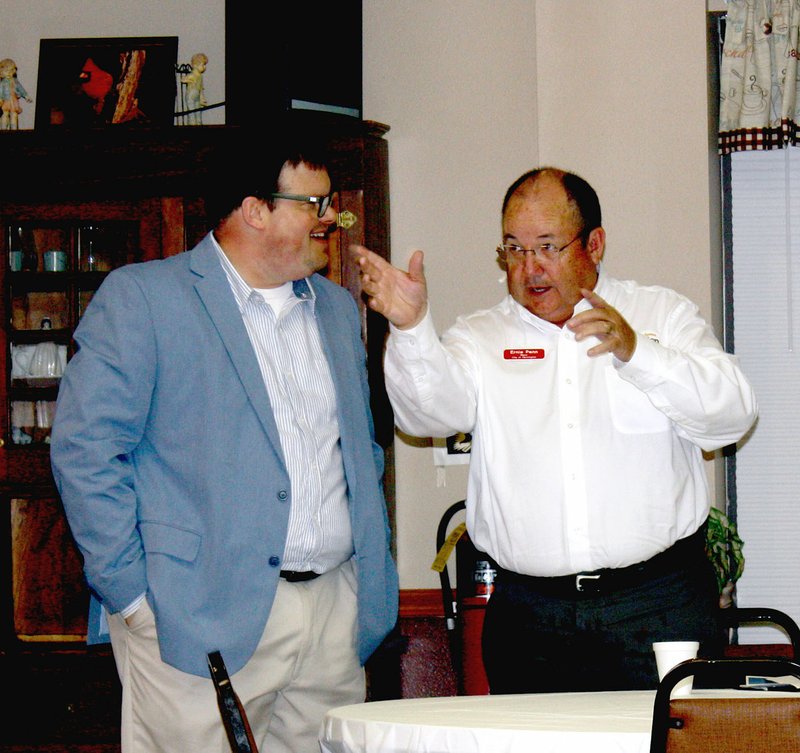 MARK HUMPHREY ENTERPRISE-LEADER Pastor Dee Harper, of Farmington United Methodist Church (left) and Mayor Ernie Penn enjoy a light moment during the fourth annual Mayor's Prayer Breakfast hosted by Penn Thursday morning at the Senior Center to observe the National Day of Prayer.