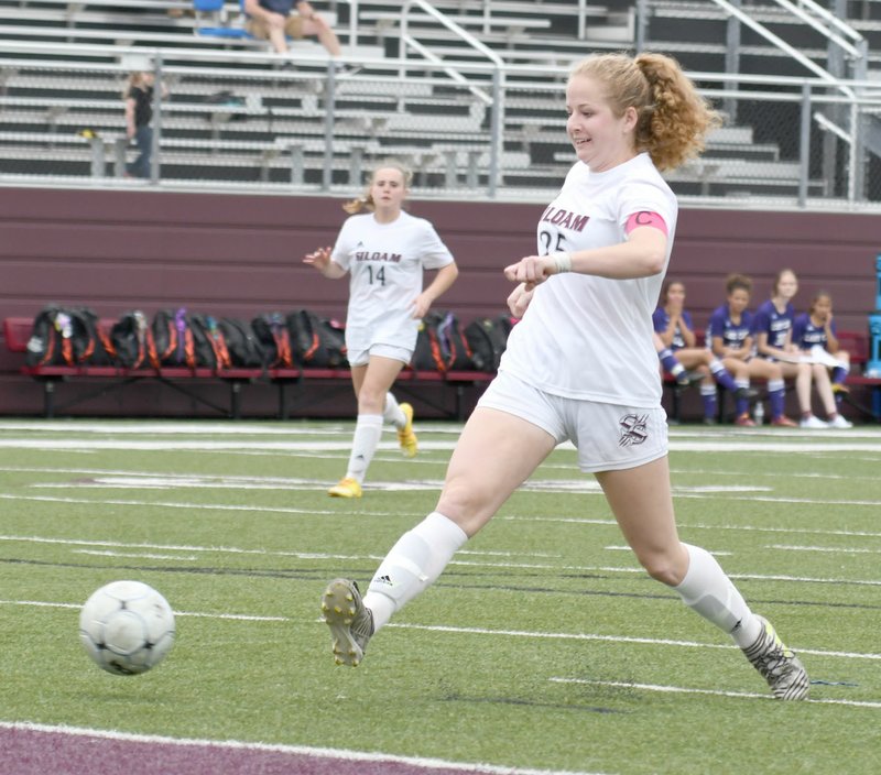 Bud Sullins/Special to the Herald-Leader Siloam Springs senior Megan Hutto takes a stab at a ball during the Lady Panthers' game against El Dorado on May 1. Hutto signed to play college soccer at Northeastern State University in Tahlequah, Okla.