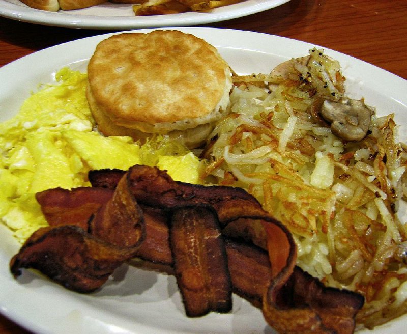 Eggs, a biscuit, hash browns and bacon are part of the Full Spread breakfast at Peppermill Cafe & Grill in Cabot. It also comes with pancakes.  