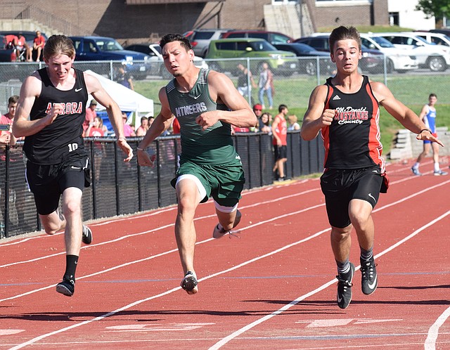 RICK PECK/SPECIAL TO MCDONALD COUNTY PRESS Corbin Jones (right) was McDonald County's lone Big 8 Conference champion after he edged Mount Vernon's Andrew Montemayor in the 100-meter dash at the Big 8 Conference Track and Field Championships held May 7 at MCHS.