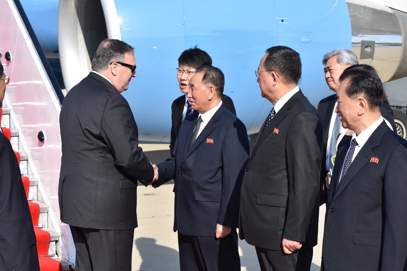 U.S. Secretary of State Mike Pompeo is greeted by senior North Korean official Kim Yong Chul, director of the United Front Department, which is responsible for North-South Korea affairs (left), and Foreign Minister Ri Su Yong, on his arrival in Pyongyang, North Korea, Wednesday, May 9, 2018. Pompeo met with North Korean leader Kim Jong Il later and secured the release of three American prisoners ahead of a planned summit between Kim and President Donald Trump. (AP Photo/Matthew Lee, Pool)