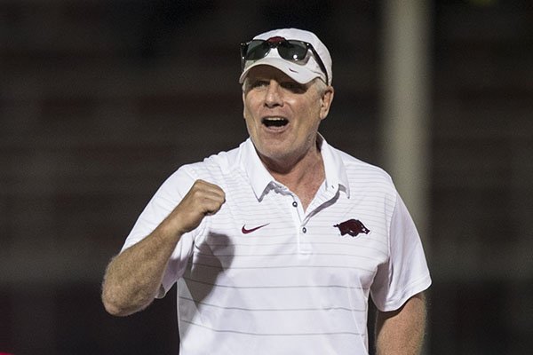 Arkansas track coach Chris Bucknam reacts during the men's distance medley relay during the National Relay Championships on Saturday, April 28, 2018, in Fayetteville.