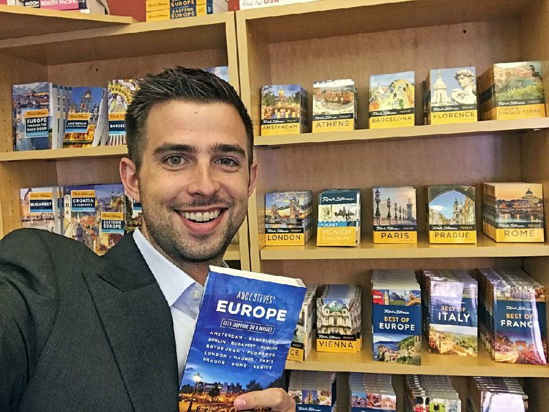 Travel guidebook writer Andy Steves shows off a copy of his book, Andy Steves’ Europe: City-Hopping on a Budget. The son of well-known writer, TV host and tour operator Rick Steves, gives advice to a new generation.  