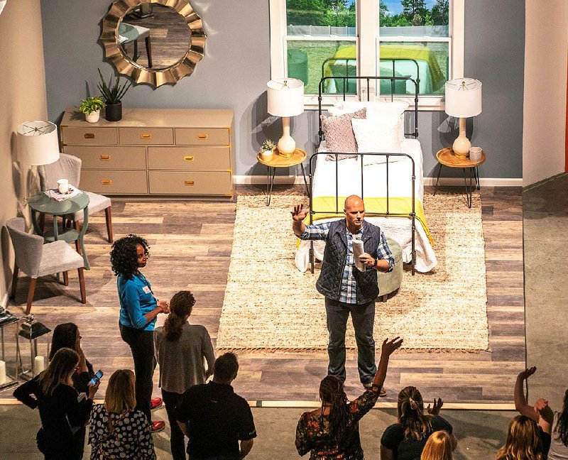 Chip Wade, a licensed general contractor with a degree in mechanical engineering who has appeared on several HGTV home shows, participates in The Home Depot’s New Homeowners event in Atlanta recently. 