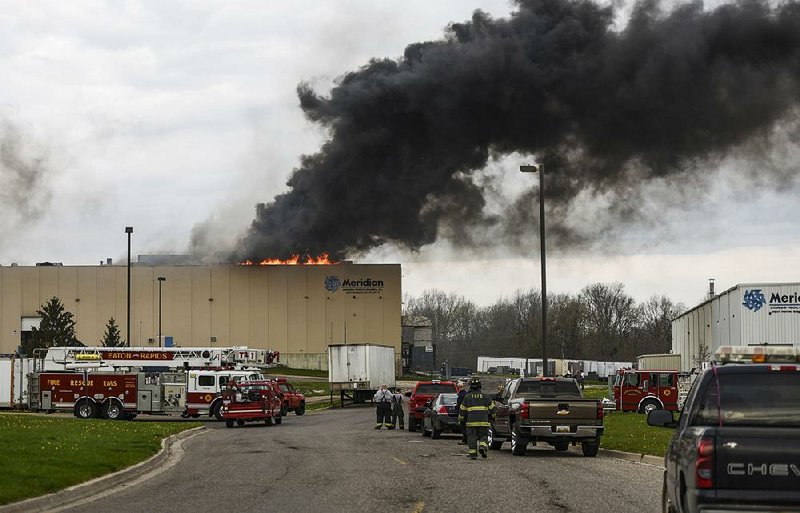 Firefighters work earlier this month to extinguish a blaze at the auto-parts plant Meridian Magnesium Products of America in Eaton Rapids, Mich. 
