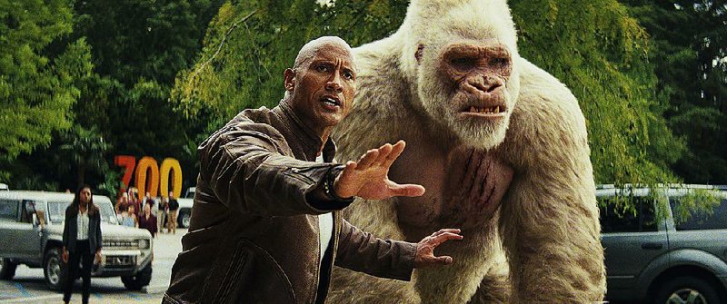 Dwayne Johnson (left) stars as Davis Okoye and Jason Liles plays George in the Warner Bros.’ release Rampage. It came in fifth at last weekend’s box office and made about $4.6 million. 
