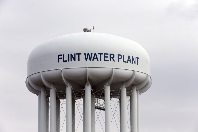 FILE - This Feb. 5, 2016 file photo shows the Flint Water Plant tower in Flint, Mich. As natural resources go, oil tends to get more attention from investors than clean drinking water, even against the backdrop of headline-grabbing shortages in Flint, South Africa and elsewhere. But a few funds are showing that investing in utilities and water infrastructure and technology companies can pay off, especially for long-term investors looking to diversify their portfolio.(AP Photo/Carlos Osorio, File)