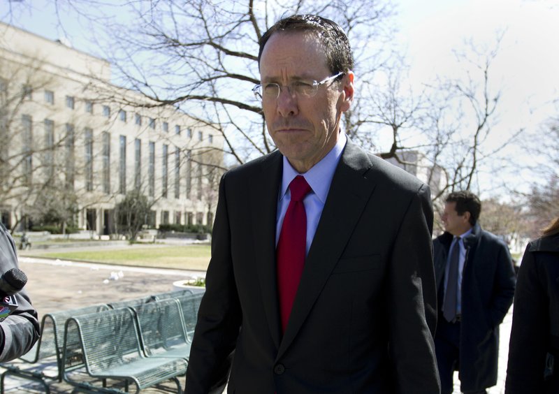 In this March 22, 2018 file photo, AT&T CEO Randall Stephenson leaves the federal courthouse in Washington. Stephenson says the company made a “big mistake” in hiring President Donald Trump’s attorney Michael Cohen as a political consultant. In an internal memo to employees, obtained by The Associated Press, Friday, May 11, Stephenson called the hiring a "serious misjudgment,'" and said that the company's chief lobbyist in Washington is leaving. 