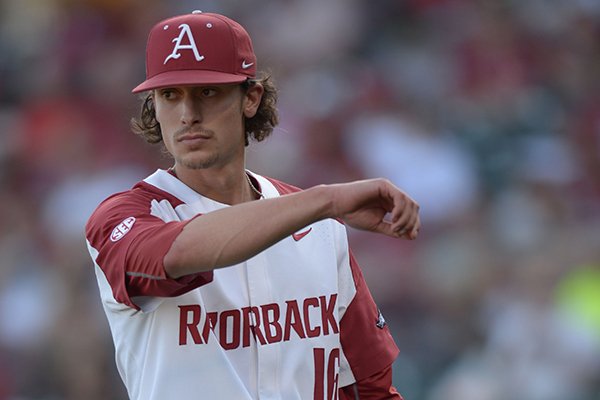 Arkansas pitcher Blaine Knight wipes his face during a game against Texas A&M on Friday, May 11, 2018, in Fayetteville. 