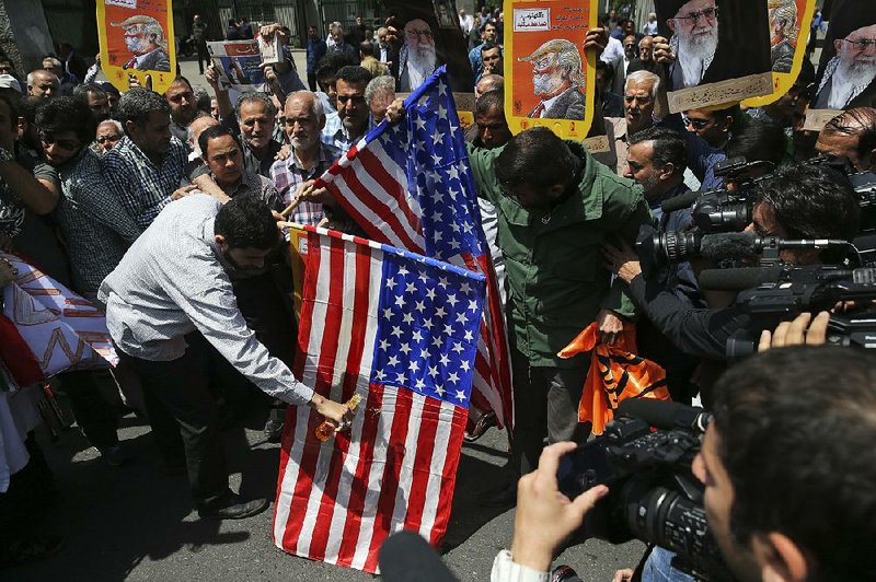 Iranians burn U.S. flags during a protest after Friday prayers in Tehran. 
