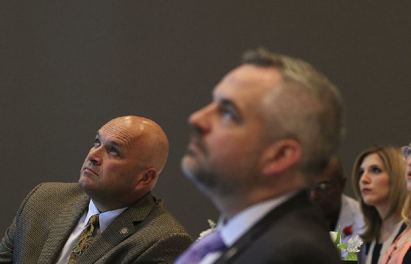 State Drug Director Kirk Lane (left) and John Kirtley, head of the state Pharmacy Board, attend a symposium on opioid addiction Friday at the University of Arkansas for Medical Sciences. 

