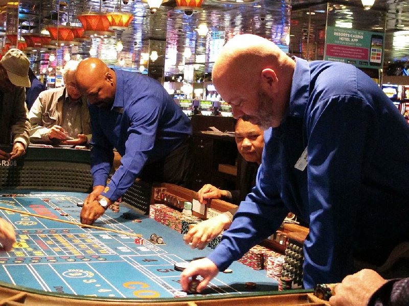 Bets are placed last month at a craps table at the Resorts Casino Hotel in Atlantic City, N.J., where two casinos shuttered in 2014 will reopen this summer. 