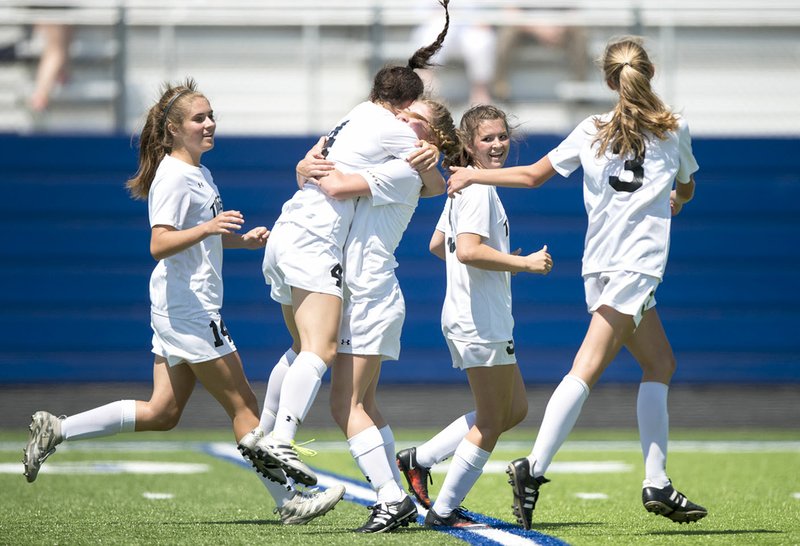 Bentonville High players celebrate after Tyler Ann Reash (second from left) scored a tie-breaking goal with less than three minutes left in a Class 7A state quarterfinal match against Mount St. Mary Academy on Friday at Whitey Smith Stadium in Rogers.