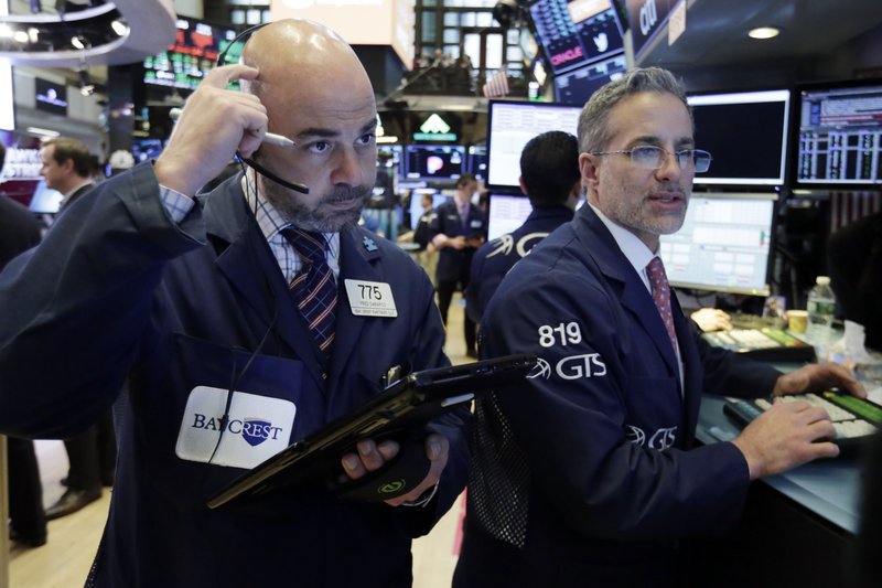 Trader Fred DeMarco, left, and specialist Anthony Rinaldi work on the floor of the New York Stock Exchange, Friday, May 11, 2018.  (AP Photo/Richard Drew)