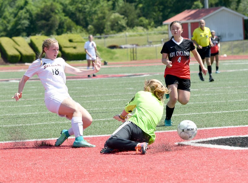 Bud Sullins/Special to Siloam Sunday Siloam Springs freshman Madison Race takes a shot that deflects off Russellville goalkeeper Bailey McGill. Race helped spark the Lady Panthers to rally for a 2-1 victory on Friday in the Class 6A state quarterfinals.
