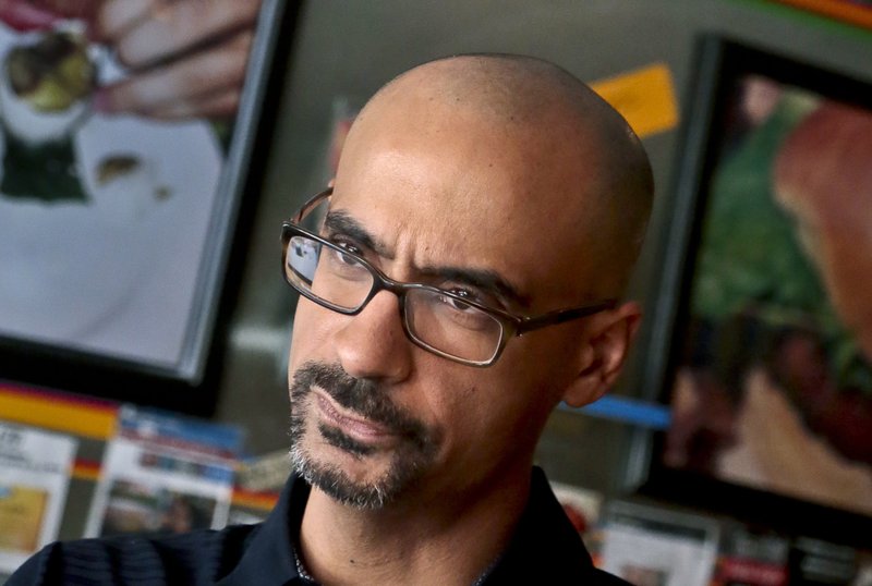 In this Sept. 3, 2013 photo, 2008 Pulitzer Prize winning author Junot Diaz pauses during an interview in New York. Diaz has long been a pioneering and polarizing figure in the literary world even before being confronted with sexual misconduct allegations on May 4, 2018, at the Sydney Writers' Festival. The Massachusetts Institute of Technology followed with an announcement it is investigating Diaz, who teaches at the university. The Pulitzer Prize Board began conducting an independent review of allegations, and Diaz was asked to relinquish his role as incoming chairman. (AP Photo/Bebeto Matthews, File)