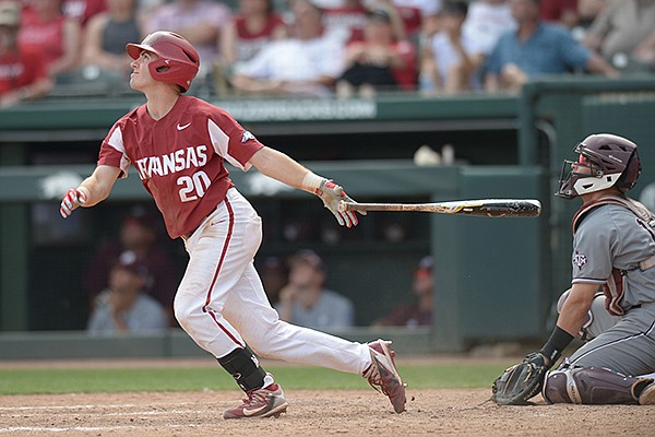 Arkansas second baseman Carson Shaddy follows through with a 2-run, RBI double to right Saturday, May 12, 2018, during the seventh inning against Texas A&M at Baum Stadium in Fayetteville.
