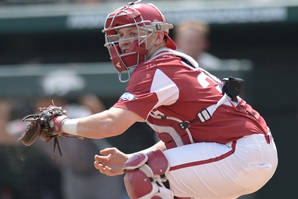 Arkansas catcher Grant Koch touches home plate during a game against Texas A&M on Saturday, May 12, 2018, in Fayetteville. 