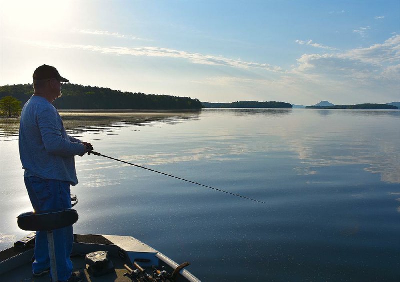 In this file photo Mike Romine of Mabelvale fishes for bass on Lake Maumelle.