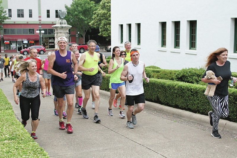 The Sentinel-Record/Rebecca Hedges
Gil Schaenzle, right, who lost her only child, 21-year-old daughter Anna Rose, to neuroendocrine tumors cancer, was joined on a run through Hot Springs National Park on Saturday by members of the Spa Pacers.