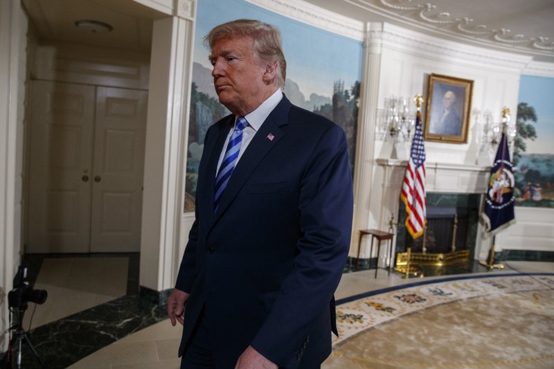 President Donald Trump walks off after delivering a statement on the Iran nuclear deal from the Diplomatic Reception Room of the White House, Tuesday, May 8, 2018, in Washington. Trump says the United States is withdrawing from the Iran nuclear deal, which he called &quot;defective at its core.&quot; (AP Photo/Evan Vucci)