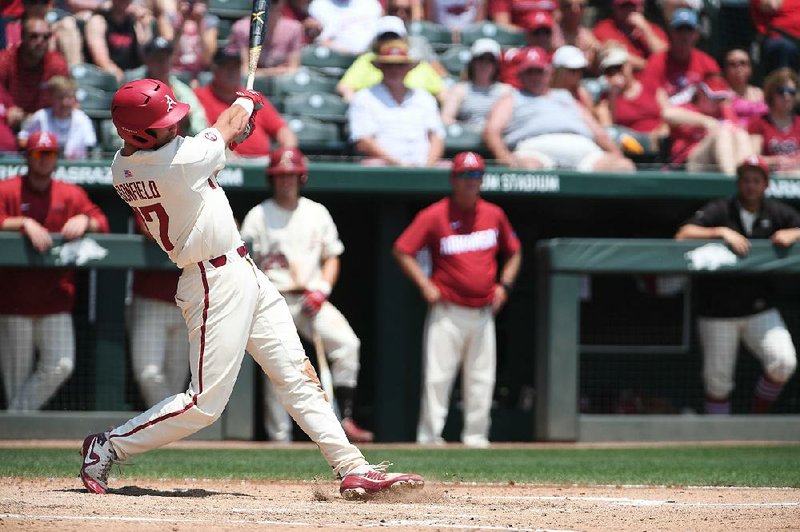 Luke Bonfield rips a home run in the third inning against Texas A&M on Sunday at Baum Stadium in Fayetteville. Bonfield drove in four runs as Arkansas won 6-3 to sweep the series. 