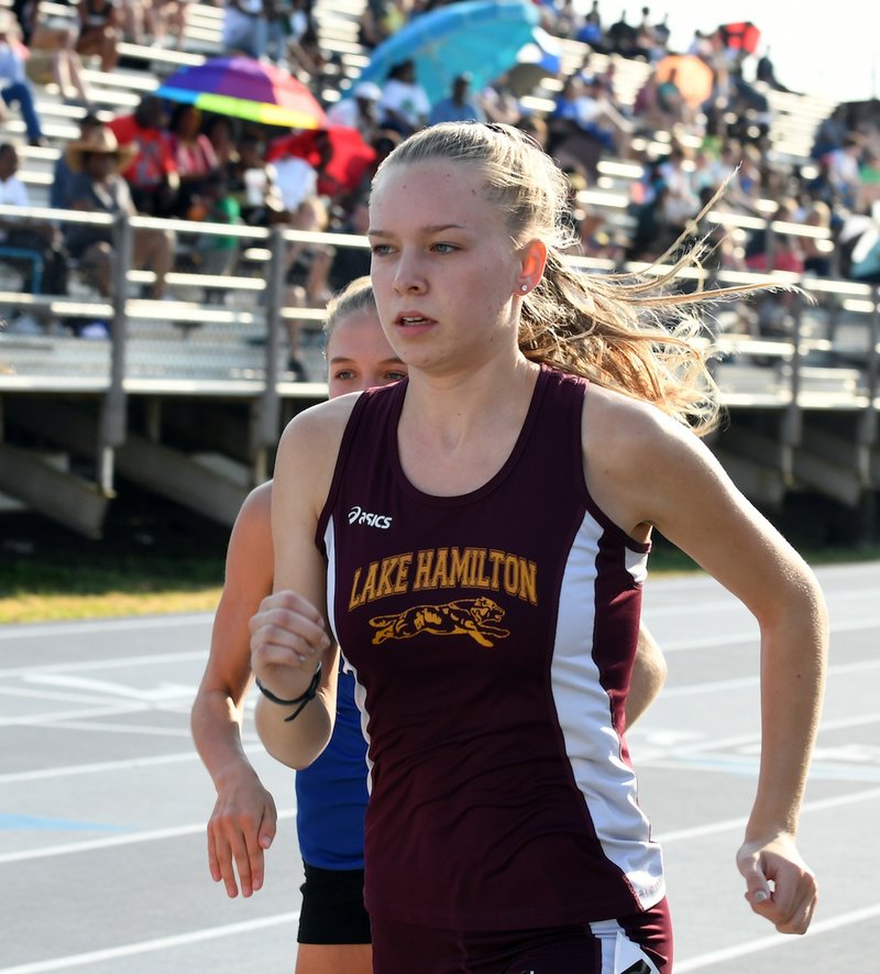 The Sentinel-Record/Grace Brown - Lake Hamilton's Josie Carson runs during the girls 1600 meter run at the Meet of Champions at Lake Hamilton Wolf Arena on Saturday, May 12, 2018. 