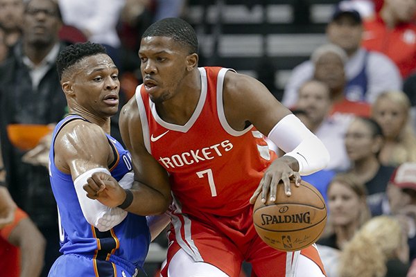 Houston Rockets guard Joe Johnson (7) drives into Oklahoma City Thunder guard Russell Westbrook (0) during the first half of an NBA basketball game Saturday, April 7, 2018, in Houston. (AP Photo/Michael Wyke)