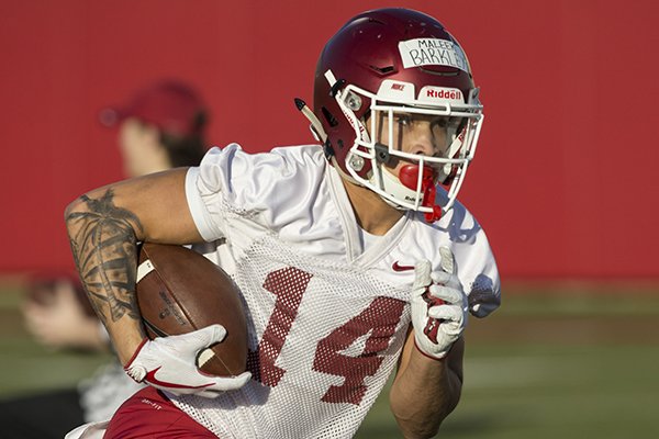 Maleek Barkley runs a drill Thursday, March 1, 2018, during Arkansas spring football practice at the Fred W. Smith Football Center in Fayetteville.