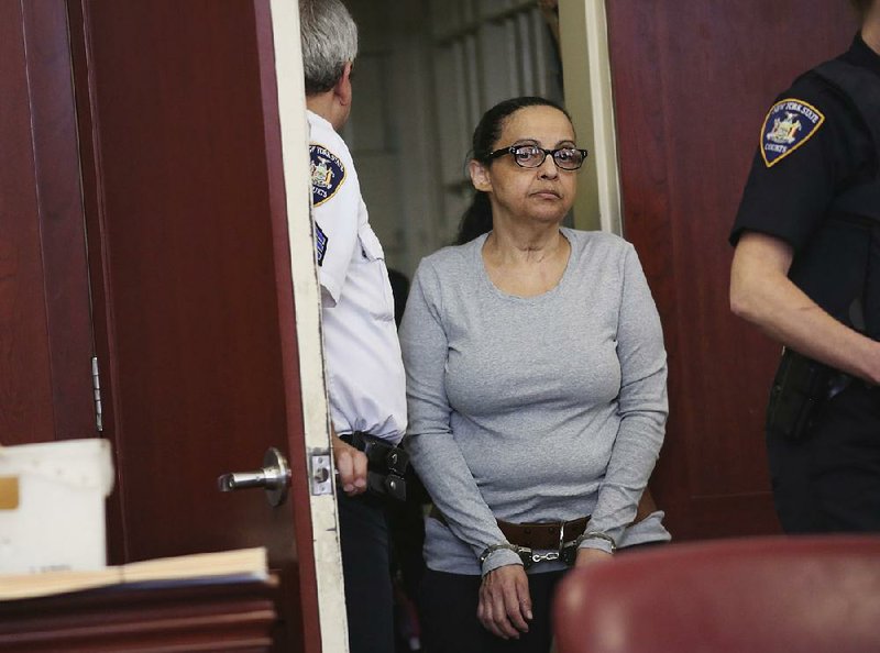 Yoselyn Ortega enters a New York courtroom Monday before sentencing in the 2012 stabbing deaths of two children. 
