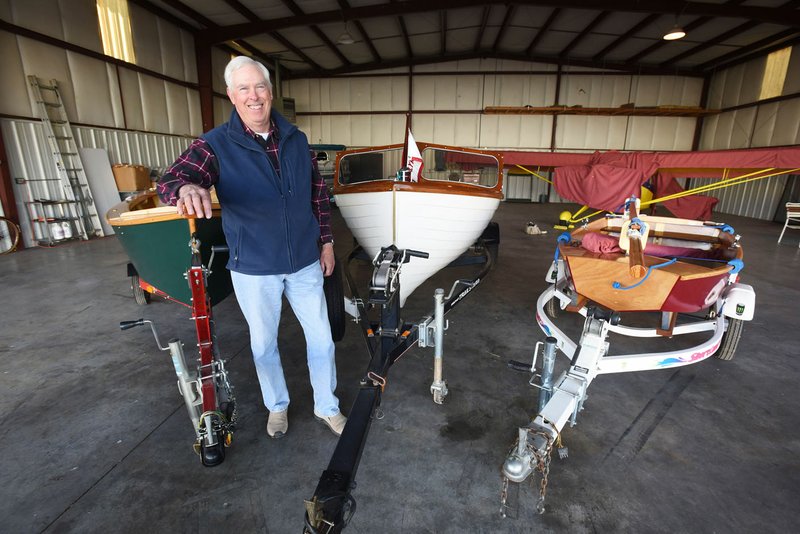 Warren Wilkey works wonders with wood, building and restoring wooden sailboats and power boats at his home near Garfield. Two sailboats and a power boat, shown here, are among ones he’s built. 