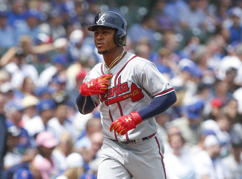 Atlanta Braves' Ozzie Albies rounds the bases after hitting a solo home run off Chicago Cubs' Jose Quintana during the first inning of a baseball game, Monday, May 14, 2018, in Chicago. (AP Photo/Kamil Krzaczynski)