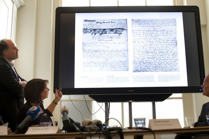 A video shows the text underneath two taped off pages from Anne Frank's diary during a press conference at The Anne Frank Foundation's office in Amsterdam, Netherlands, on Tuesday, May 15, 2018.