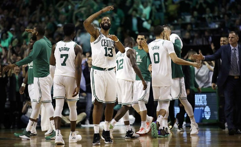 Boston Celtics forward Marcus Morris (13) celebrates in the closing minutes of the Celtics’ 107-94 victory over the Cleveland Cavaliers in Game 2 of the NBA Eastern Conference finals Tuesday night in Boston. The Celtics lead the series 2-0. 