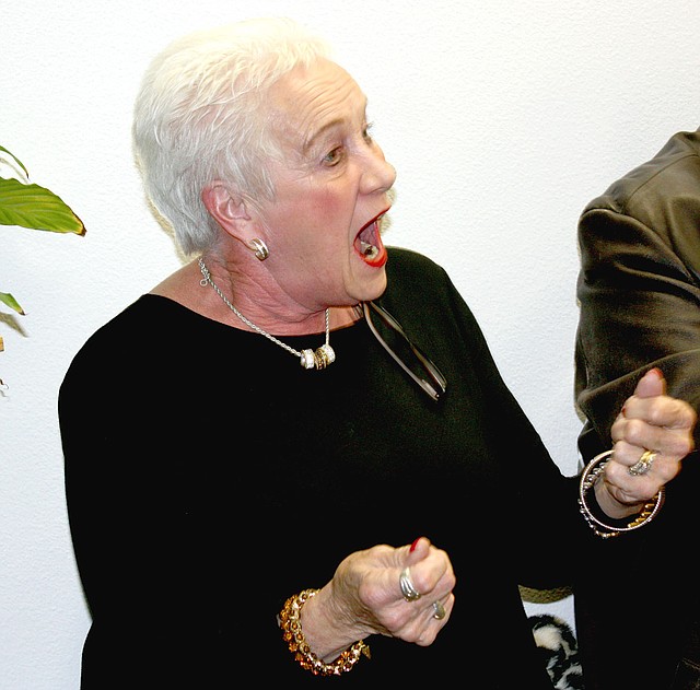 MARK HUMPHREY ENTERPRISE-LEADER Folsom Elementary paraprofessional Marie Easterling displays some of the exuberance that made her recipient of the Sam's Furniture Above &amp; Beyond award for January. The award was presented during the Jan. 22 school board meeting.