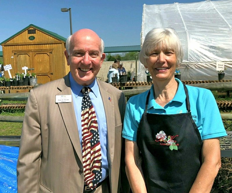 Photo Submitted Mayor Christie visits with Cathy Downard, Plant Sale Chairman, on the success of the BVGC's annual plant sale.