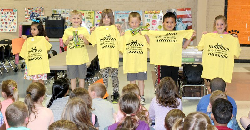 Submitted Photo "Pawsitive" and Wise Students of the Month at Glenn Duffy Elementary School were recognized at the school's monthly Rise and Shine assembly May 7. PAWS award winners for May, displaying the T-shirts they received, are Bella Allen (left), Kyngston Traxler, Kaylee McCaslin, Isaiah Cordeiro, Kenji Vang and Ava Brown.