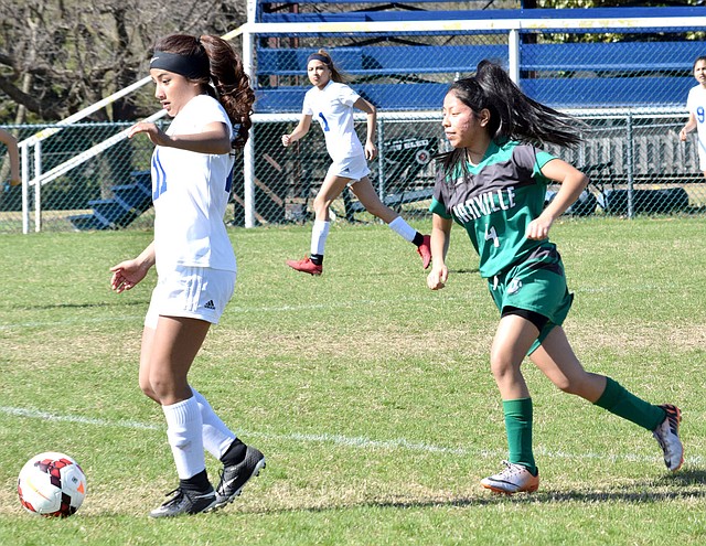 Westside Eagle Observer/MIKE ECKELS Lady Bulldogs' Kaylee Morales moves the ball toward the Lady Little Johns' net during the Decatur-Danville varsity girls' soccer match at Bulldogs Stadium in Decatur April 10. Morales was named to the 4A-1 All-Conference soccer team May 9.