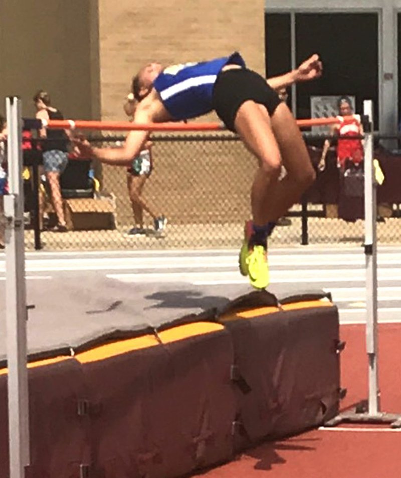 Westside Eagle Observer/SUBMITTED Destiny Mejia, a member of the Lady Bulldogs 1A champion track team, clears the bar in the high jump during the Arkansas Activities Association's Meet of Champions May 12 at Lake Hamilton High School track and field facility.