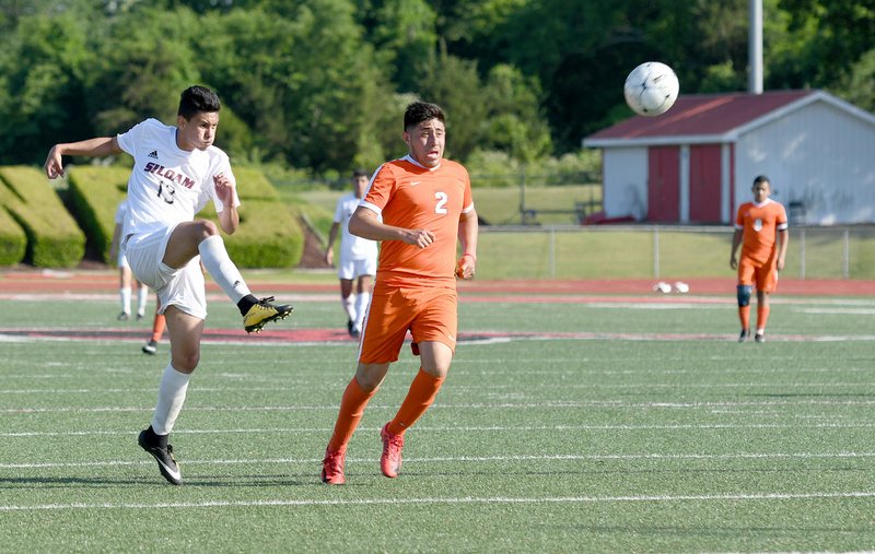 Bud Sullins/Special to the Herald-Leader Gerson Matias of Siloam Springs kicks the ball away against Little Rock Hall on Friday in the Class 6A quarterfinals.