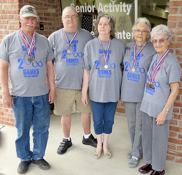 Westside Eagle Observer/RANDY MOLL Showing the medals they won at the May 4 Senior Olympics in Harrison are Johnny Burger, James Tucker, Deanne Tucker, Maxine Foster and Vel Hornberger. Members of the Gentry Senior Activity Center participated in the 34th Senior Olympics and brought back 13 medals this year.