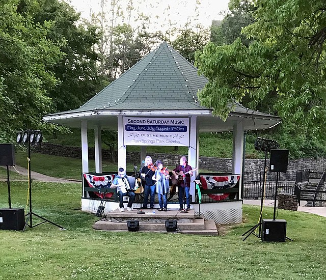 Jackie Brooks/Herald-Leader &quot;Fiddles in the Middle&quot; were the featured performers at the inaugural Second Saturday Music of the season on Saturday. Band members are Kathy Sutterfield, Richey McCusker, and Bill and Deanna Lisk. The next concert is planned for June 9 at the Twin Springs Gazebo Park.