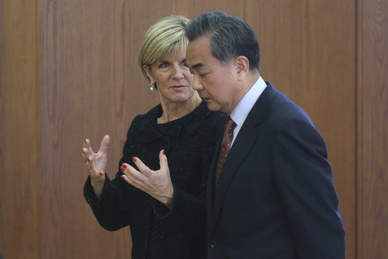 FILE - In this Feb. 17, 2016, file photo, Australian Foreign Minister Julie Bishop, left, and Chinese Foreign Minister Wang Yi talks while leaving after their joint press conference at the Ministry of Foreign Affairs in Beijing. Australia's Prime Minister Malcolm Turnbull has rejected a former diplomat's opinion that the country needs a new foreign minister to thaw relations with China. Geoff Raby was Australia's ambassador to Beijing from 2007 to 2011. He used a scathing column in The Australian Financial Review newspaper on Tuesday, May 15, 2018, to call for Foreign Minister Julie Bishop to be replaced. (Wu Hong/Pool Photo via AP, File)