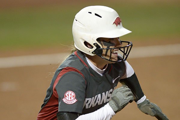 Arkansas senior Autumn Buczek watches as an RBI double sails to the outfield to score the winning run Mississippi State Friday, March 30, 2018, during the seventh inning at Bogle Park in Fayetteville. 